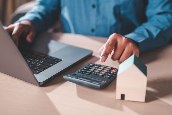 Model house and financial documents for investment planning