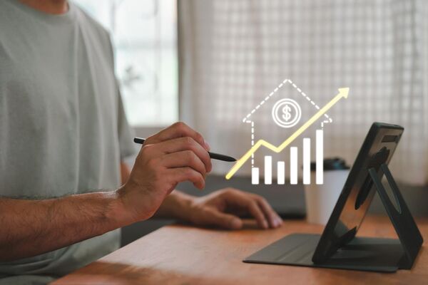 Person researching finance rates on laptop